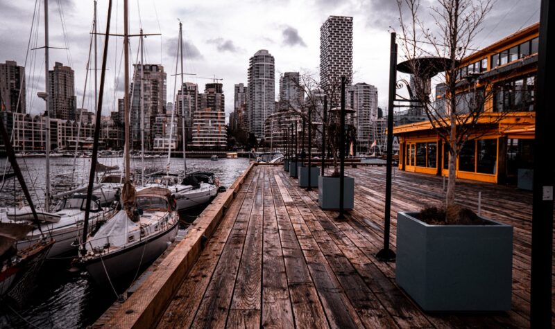 white boat near brown wooden dock