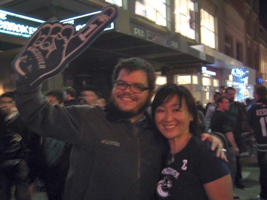 My friend, Jen, and I (Yuri Artibise) celebrate on Granville St in downtown Vancouver